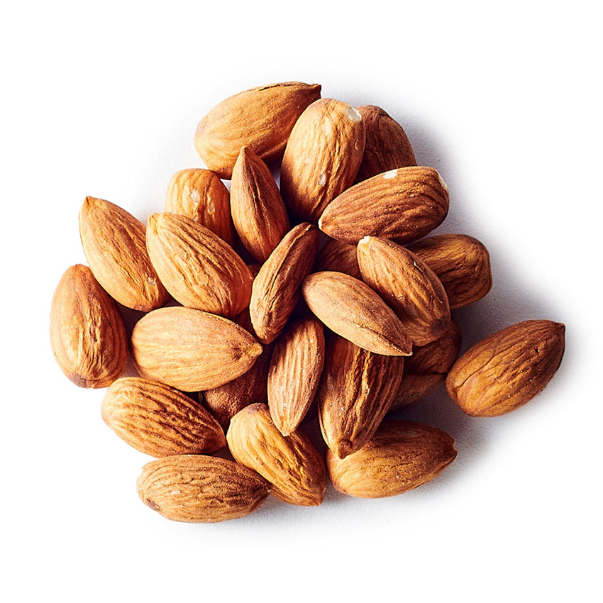 Pile of almonds on a white background