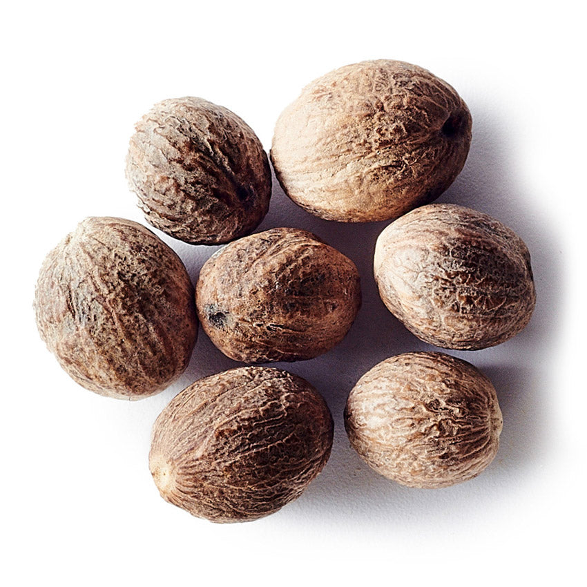 Group of nutmegs on a white background