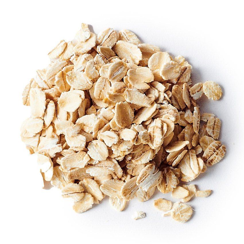 Pile of rolled oats on a white background