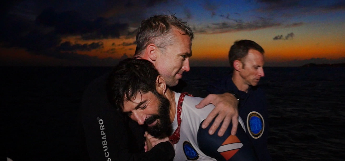 Rudy Reyes with the Force Blue dive team during sunset after a long mission.
