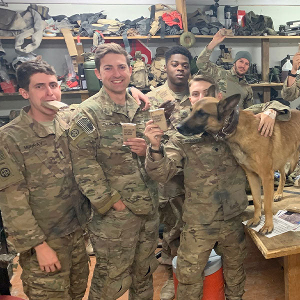 US Army soldiers smiling and holding Condition One Protein Bars.