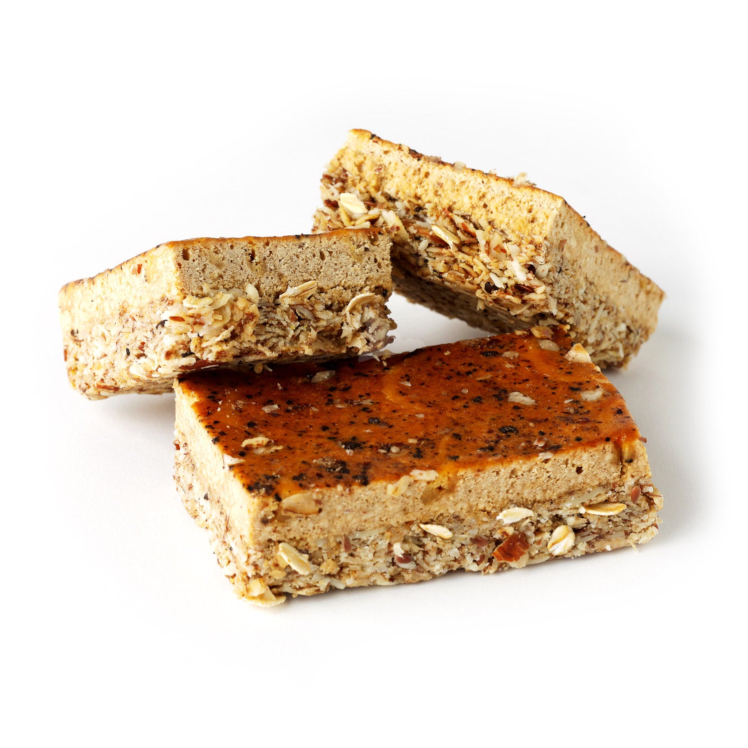 A stack of three Condition One high-protein bars with a French Vanilla Latte flavor, showing the texture and ingredients like oats and nuts.