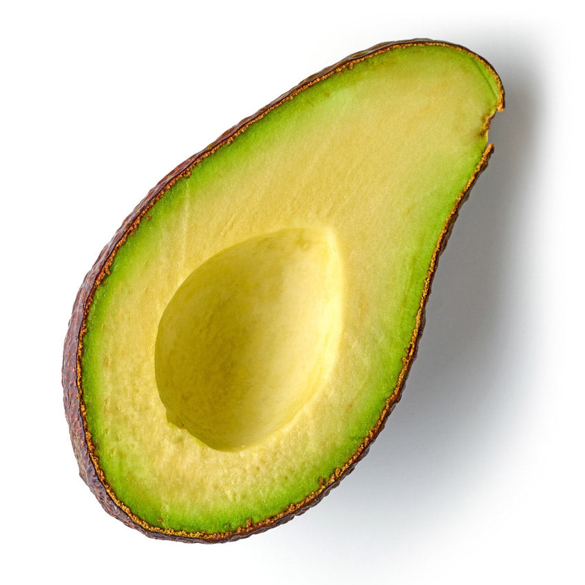 Half-cut avocado on a white background