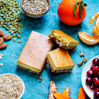 Condition One protein bar Cranberry Orange flavor surrounded by ingredients.